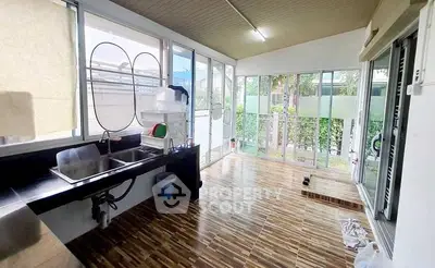 Spacious kitchen with large windows and modern design