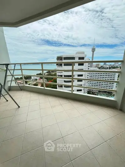 Spacious balcony with stunning city and ocean views, perfect for relaxation and enjoying the skyline.