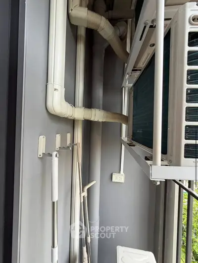 Compact balcony with air conditioning unit and cleaning tools
