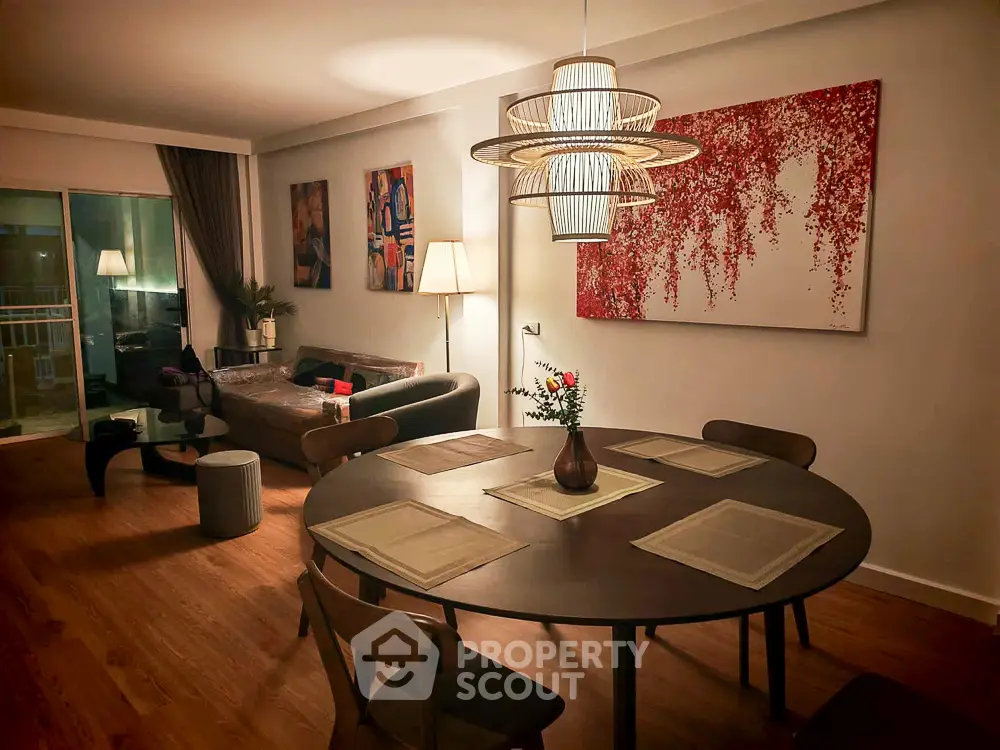 Elegant living room with modern decor, stylish lighting, and cozy seating area, perfect for relaxation and entertainment.