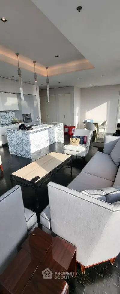 Luxurious modern living room with open kitchen and elegant furnishings