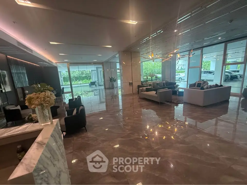 Luxurious building lobby with elegant seating and marble flooring