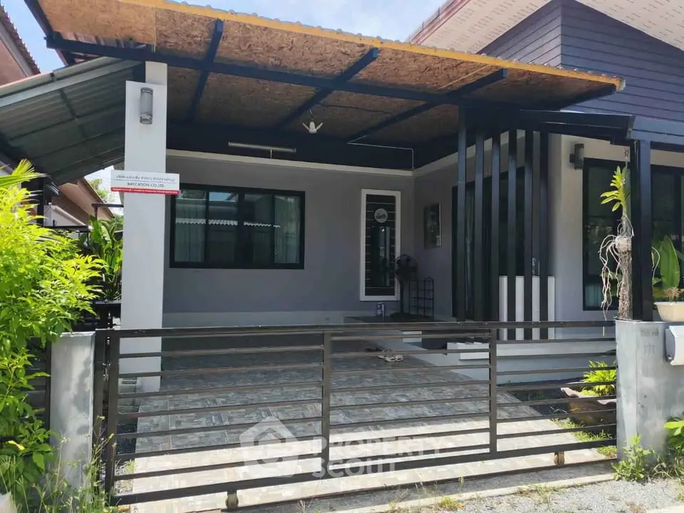 Modern single-story house with covered carport and sleek exterior design.