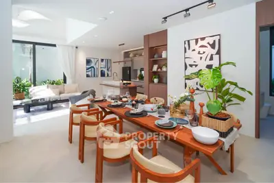 Luxurious open-plan living and dining area with modern decor and abundant natural light.