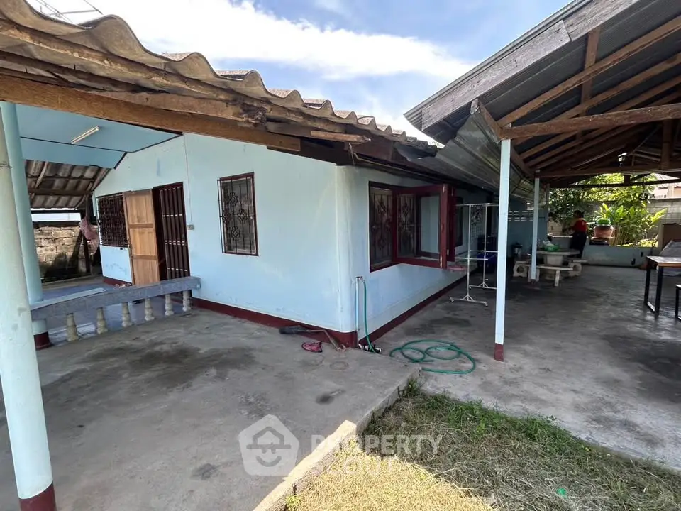 Charming rustic home with spacious outdoor area and covered patio.
