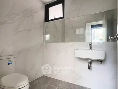 Modern bathroom with sleek design and large mirror