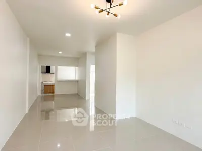 Spacious modern living room with sleek tile flooring and stylish lighting