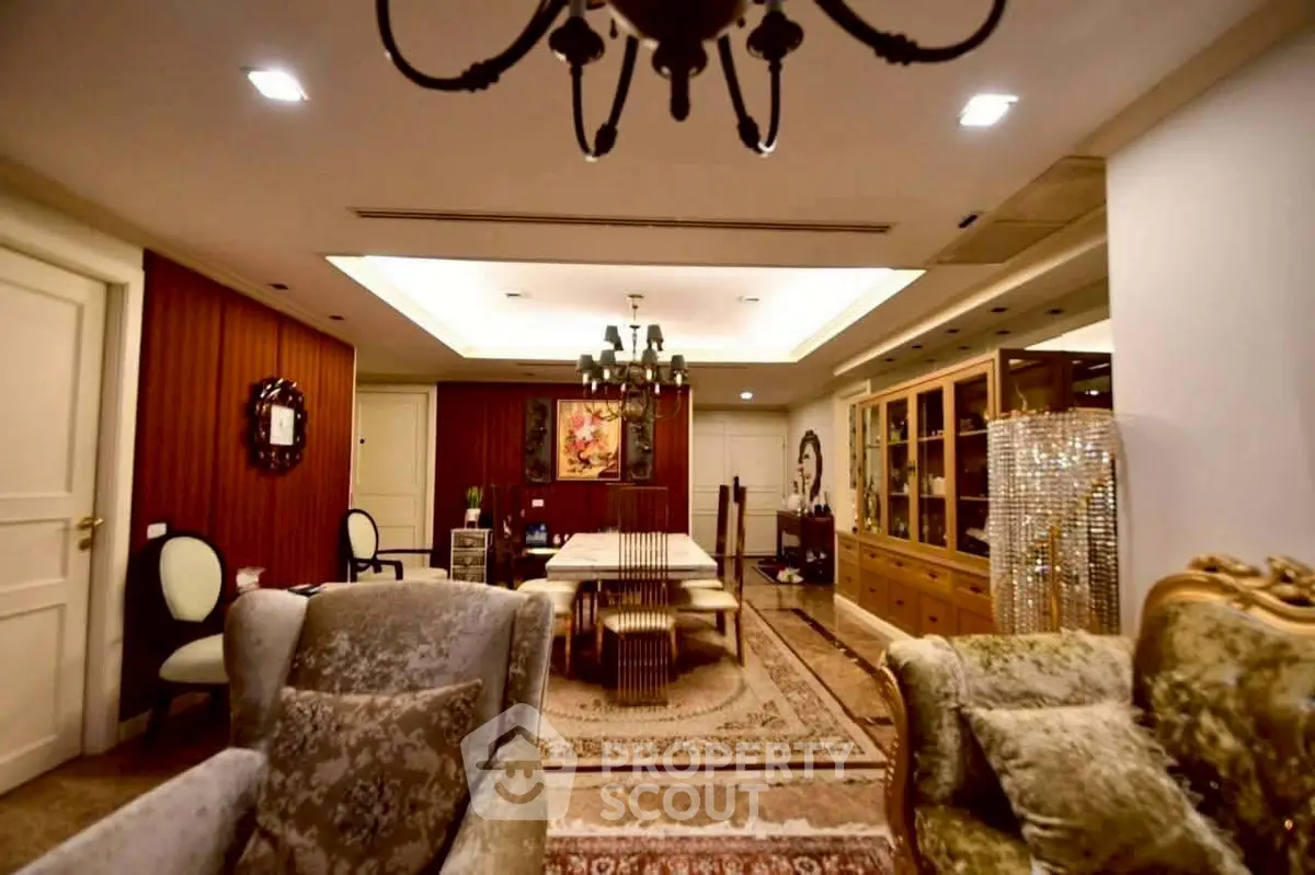 Luxurious living room with elegant decor and chandelier lighting