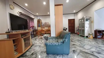 Spacious living room with marble flooring and modern furniture
