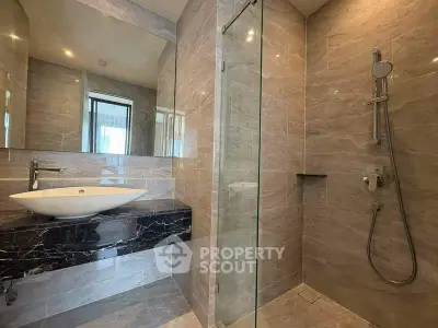 Luxurious modern bathroom with sleek design and glass shower enclosure