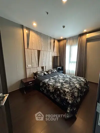 Modern bedroom with stylish decor and natural light