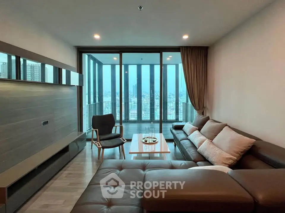 Luxurious living room with panoramic city view and spacious balcony