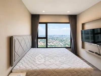 Luxurious bedroom with stunning city view and modern decor