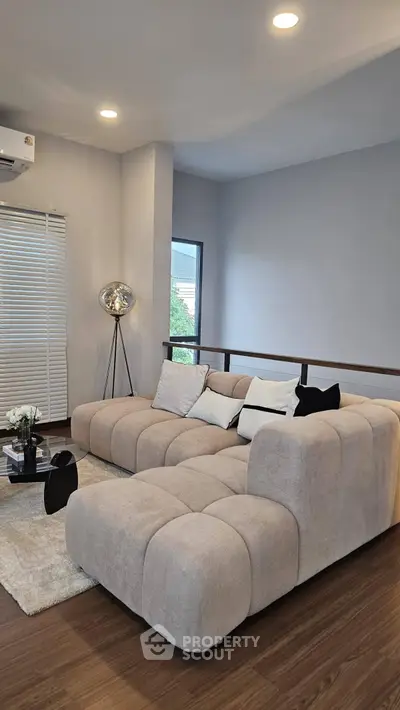 Modern living room with plush sectional sofa and stylish decor