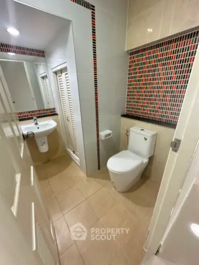 Modern bathroom with stylish tile accents and sleek fixtures