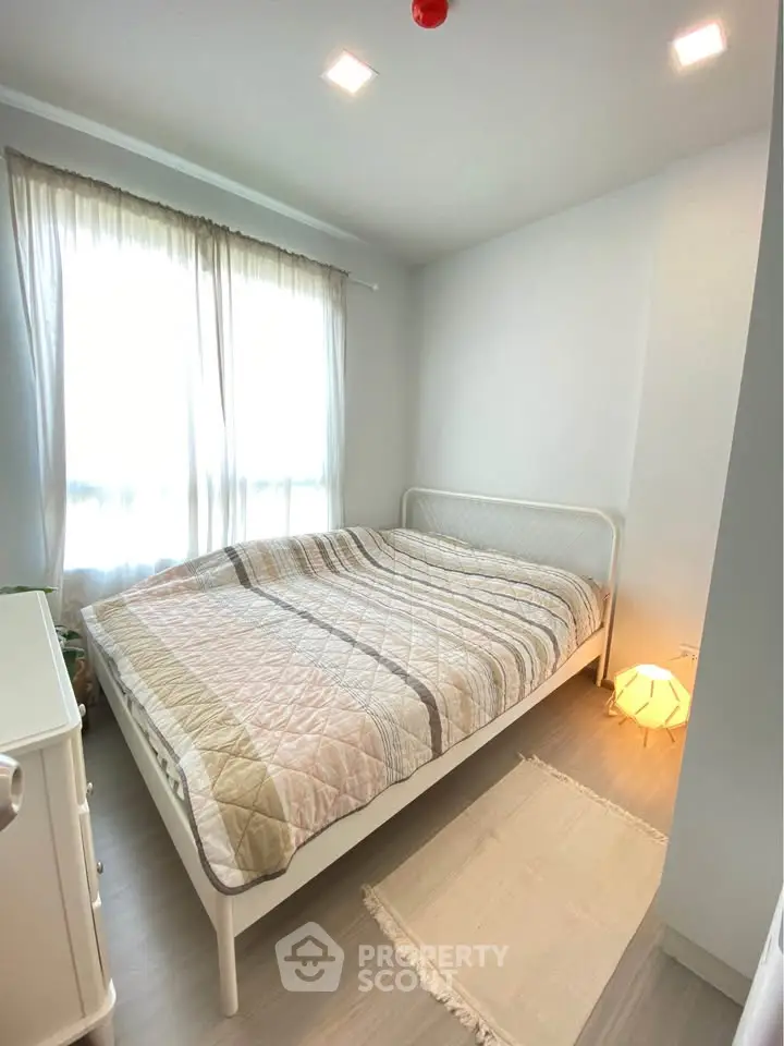 Cozy bedroom with natural light and modern decor