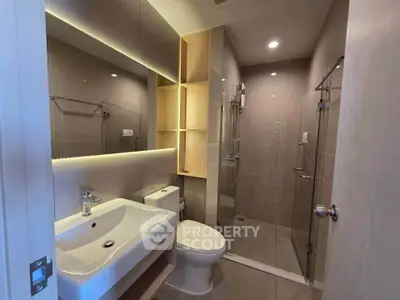 Modern bathroom with sleek design and glass shower enclosure