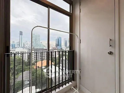 Stunning city view from modern balcony with sleek railing design.