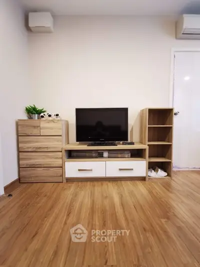 Modern living room with wooden flooring and stylish TV stand