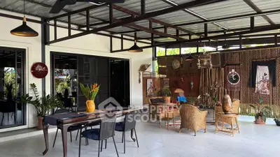 Charming open-air living space with rustic decor and lush greenery