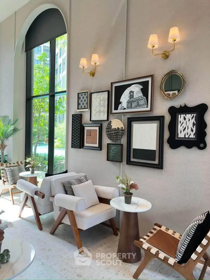 Elegant living room with stylish decor and large windows overlooking greenery, perfect for modern living.