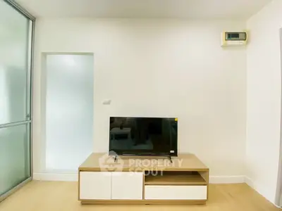 Modern living room with sleek TV stand and minimalist decor