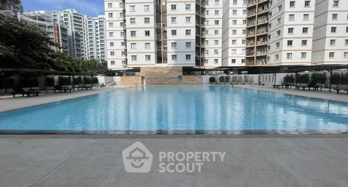 Luxurious residential complex with a stunning outdoor pool and modern architecture.