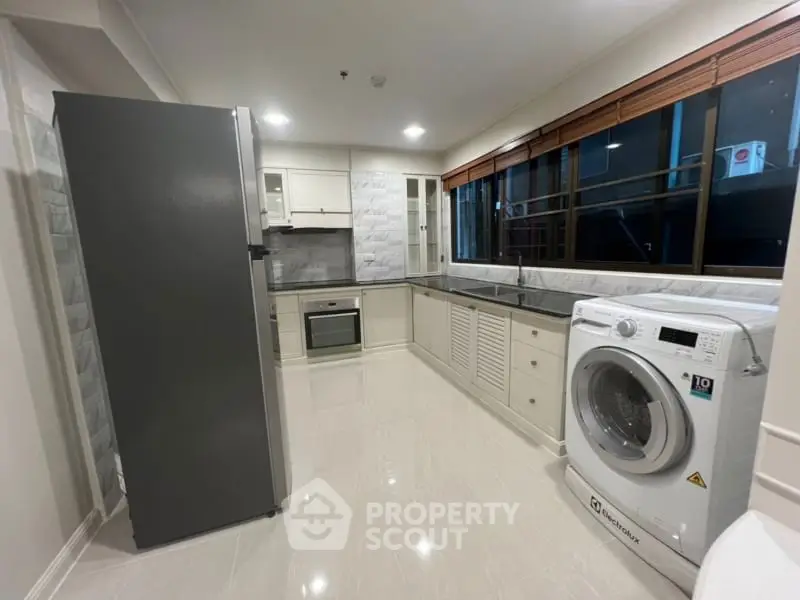 Modern kitchen with sleek appliances and spacious layout