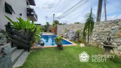 Stunning backyard with lush garden and inviting swimming pool, perfect for relaxation and entertainment.