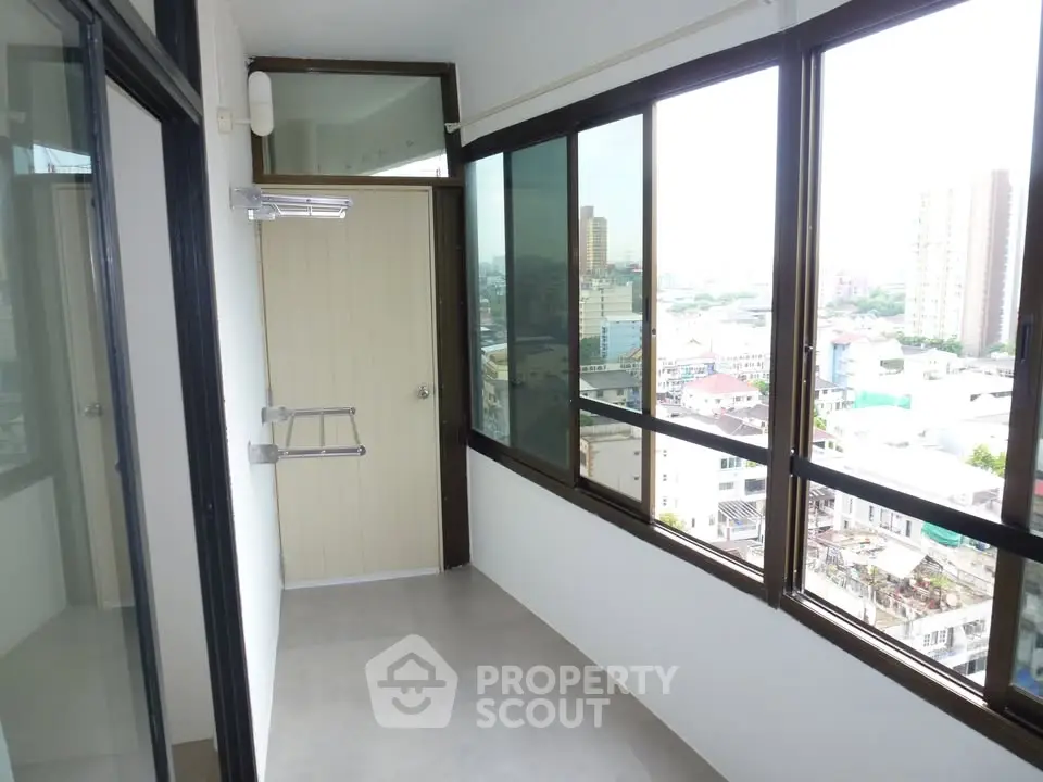 Spacious balcony with city view in modern apartment