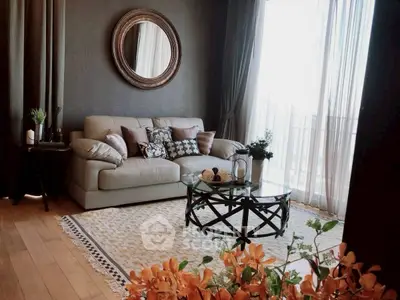 Elegant living room with stylish decor and large window for natural light