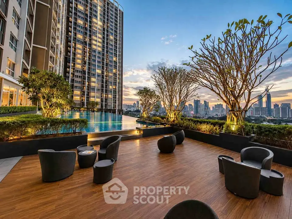 Luxurious rooftop pool with stunning city skyline views and elegant seating area.