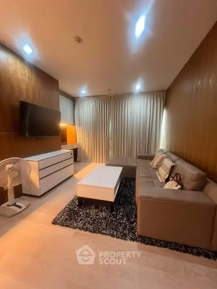 Modern living room with sleek furniture and ambient lighting