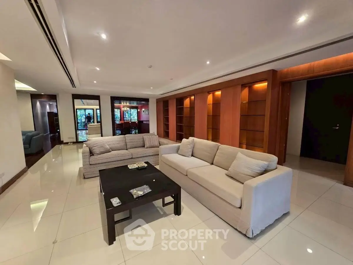 Spacious modern living room with elegant sofas and sleek tile flooring