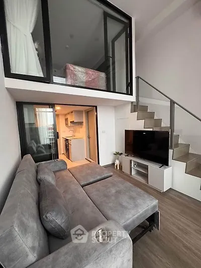 Modern loft apartment with stylish living room and mezzanine bedroom