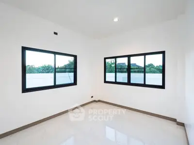 Spacious corner unit with large windows offering natural light and serene views, perfect for modern living.