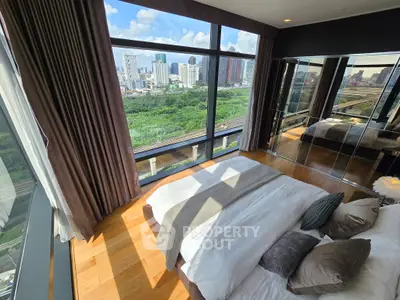 Luxurious bedroom with panoramic city view and elegant decor