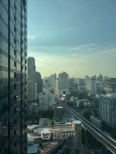Stunning cityscape view from high-rise building showcasing urban skyline and modern architecture.