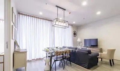 Stylish modern living room with elegant decor and ample natural light