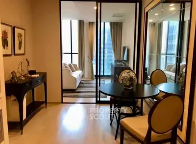 Elegant modern living room with glass doors and stylish decor