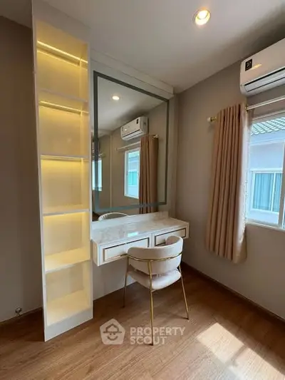 Stylish bedroom with elegant vanity and modern lighting