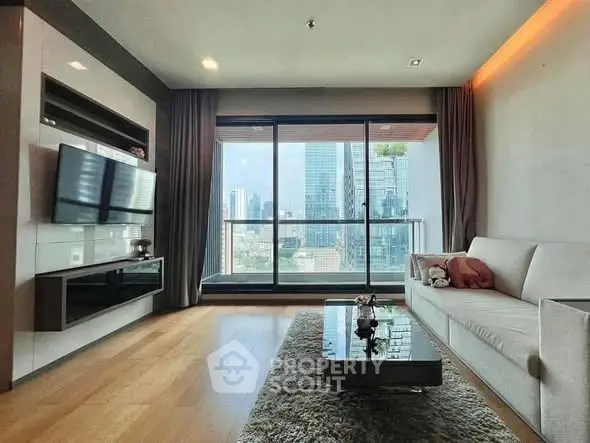 Modern living room with city view, sleek furniture, and large windows.