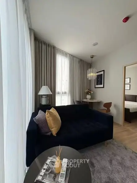 Modern living room with stylish decor and cozy seating in a contemporary apartment.