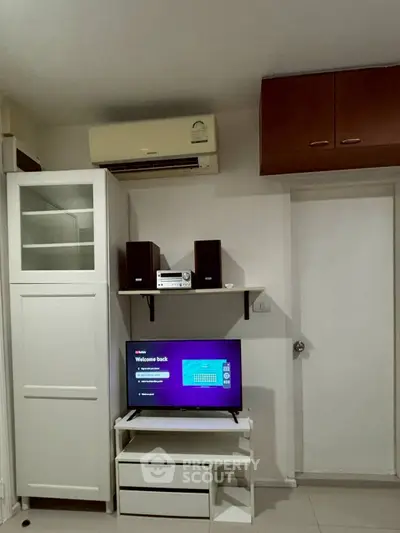 Modern living room with air conditioning and entertainment setup