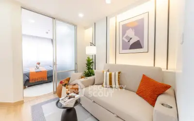 Modern living room with stylish decor and cozy seating area in a contemporary apartment.