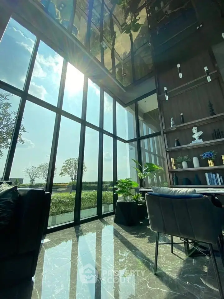 Luxurious living room with floor-to-ceiling windows and stunning outdoor view