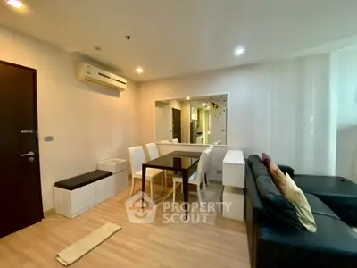 Modern living room with sleek furniture and air conditioning in a cozy apartment.