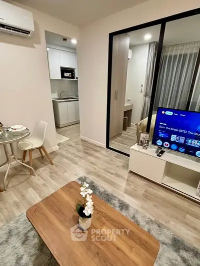 Modern living room with open kitchen and stylish decor