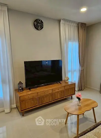 Modern living room with stylish wooden TV stand and elegant decor