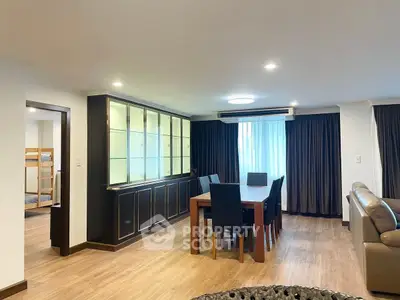 Spacious living room with elegant dining area and modern furnishings
